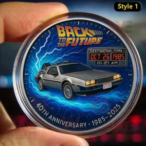 A coin showing the DeLorean time machine with Back to the Future 40th Anniversary 1985 to 2025 text.