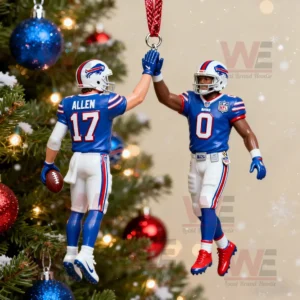 Two Buffalo Bills football player ornaments high fiving on a decorated Christmas tree.