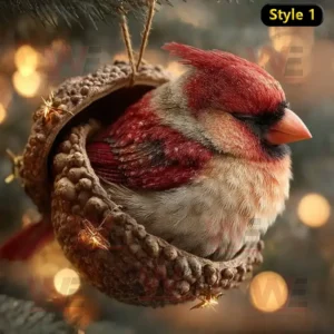 A red bird sleeping inside an acorn ornament on a Christmas tree with warm lights!