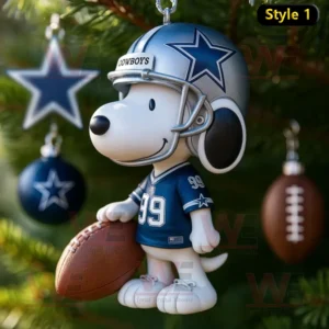 Snoopy dressed in a Dallas Cowboys football uniform holding a football on a Christmas tree.