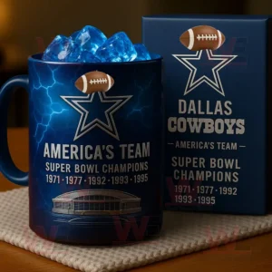 A blue Dallas Cowboys mug with team logo and Super Bowl championship years printed on it!```