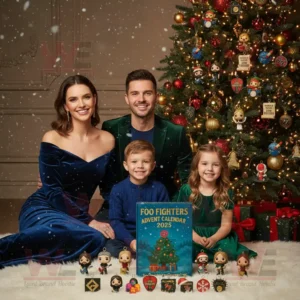 Family with Foo Fighters Advent Calendar 2025 in front of a Christmas tree.