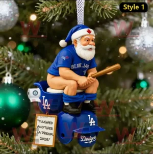 Santa in Blue Jays outfit sitting on LA Dodgers toilet ornament hanging on Christmas tree.