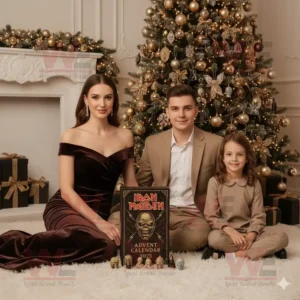 A family posing with an Iron Maiden Advent Calendar 2025 in front of a Christmas tree.