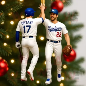Two Los Angeles Dodgers player ornaments high fiving on a decorated Christmas tree.
