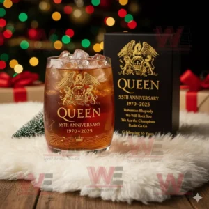 A Queen 55th Anniversary whiskey glass and gift box with festive lights in the background.