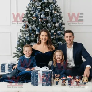Family in blue outfits sitting by Christmas tree with Utah State Aggies Advent Calendar and small figurines!