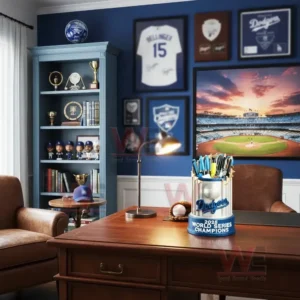 2025 LA Dodgers Championship Commemorative Pen Holder 7 Dodgers 2025 World Series Champions pen holder on a desk in a sports themed office with memorabilia and framed jerseys on the wall.