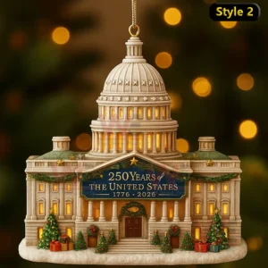 A holiday ornament showing a domed building with glowing windows garlands trees and a banner marking two hundred fifty years of the United States!