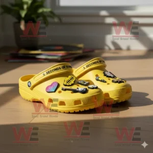 5 Seconds of Summer Crocs Clogs with Charms 8 Yellow Crocs with band charms on wooden floor under sunlight!