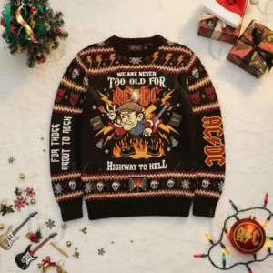 Flat lay of AC DC Highway To Hell Christmas sweater surrounded by lights, gifts, and festive decorations!