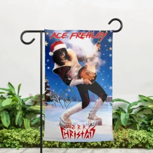 Alt text: Christmas flag of Ace Frehley in a Santa hat playing guitar, displayed outdoors with snowflakes.