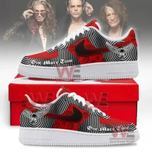 A pair of red and black patterned sneakers placed on a red box with detailed music themed graphics!