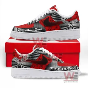 Side view of red and black graphic sneakers resting on a red box emphasizing their bold artistic design!