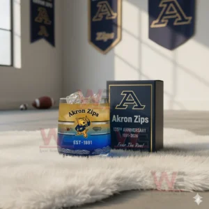 Akron Zips themed anniversary glass with ice placed on a soft rug in a bright sports room with team banners and footballs nearby!