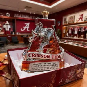 The image presents an Alabama Crimson Tide trophy bottle carefully placed in a luxurious gift box lined with smooth fabric creating an elegant display!