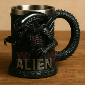 Alien 3D Sci-Fi Monster Stainless Steel Cup 6 A black alien themed mug with a sculpted creature front and raised lettering resting on a wood tabletop!