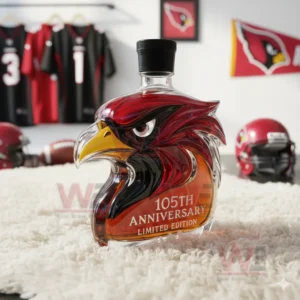 A cardinal design bottle set on a soft white rug with football equipment in the background!