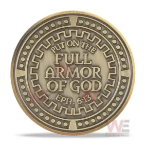 A back view of a round coin featuring a central spiritual message within a decorative ring!