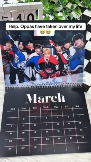 ATEEZ calendar January page featuring a member in a stylish black suit against a simple white background!