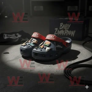 Bailey Zimmerman Crocs Clogs with Charms 6 Bailey Zimmerman Crocs placed on a dark stage with focused lighting showing charms like a guitar, truck, and sunset scene with a branded box behind!
