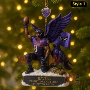 A Baltimore Ravens themed Christmas ornament showing a number 8 player kneeling on snow, raising a football, with wings, a raven, and a purple flag in the background.