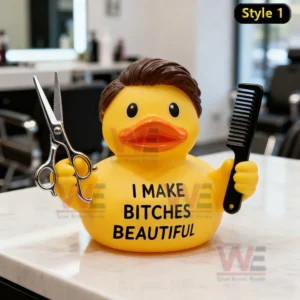 Rubber duck with styled hair holding scissors and comb on a salon counter with barber tools and mirrors behind it!