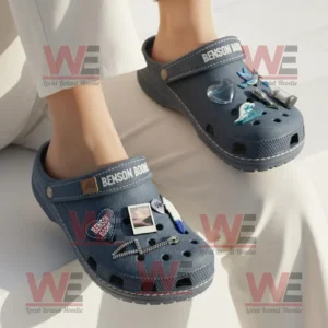 Benson Boone Crocs Clogs with Charms 7 Close-up of someone wearing navy Benson Boone Crocs with charms in soft light.