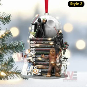A Star Wars ornament featuring characters around stacked movie themed books and a top station sphere labeled Style two!