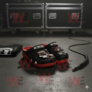 Big Time Rush Crocs Clogs with Charms 6 Black and red Big Time Rush Crocs with music charms on a stage floor.