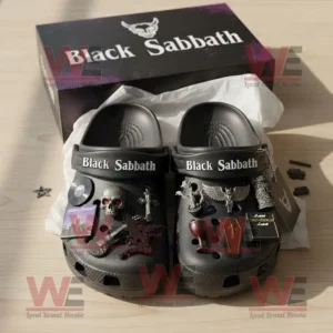 Black Sabbath Crocs Clogs with Charms 7 Black Sabbath themed Crocs with gothic charms arranged neatly in an open box.