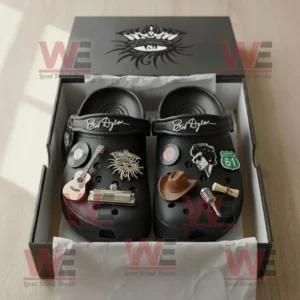Bob Dylan Crocs Clogs With Charms 7 Bob Dylan signature Crocs shown in packaging with detailed charms themed around classic folk music instruments and legendary imagery!
