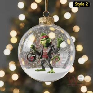 Christmas ornament showing the Grinch in rock style outfit holding a Bon Jovi themed ornament.