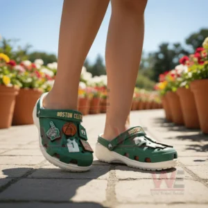 Boston Celtics Crocs Crocband Clogs With Charms 7 Person wearing green Boston Celtics clogs outdoors on a stone path near vibrant flowers!