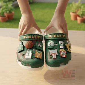 Boston Celtics Crocs Crocband Clogs With Charms 8 Green Boston Celtics clogs held on a wooden table outdoors!