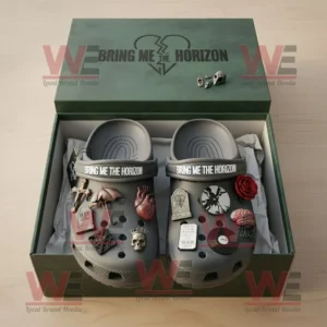 Bring Me the Horizon Crocs Clogs with Charms 7 Bring Me The Horizon themed Crocs displayed in packaging with detailed rock and dark aesthetic charms on a wooden surface!