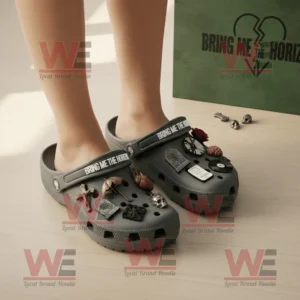 Bring Me the Horizon Crocs Clogs with Charms 8 Bring Me The Horizon Crocs worn by a person emphasizing the gothic rock styled decorations with packaging in the background!