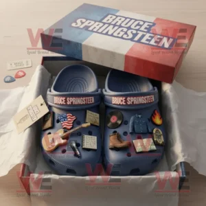 Bruce Springsteen Crocs Clogs with Charms 7 Bruce Springsteen themed Crocs arranged in packaging with multiple music related charms and patriotic motifs on a wooden surface!