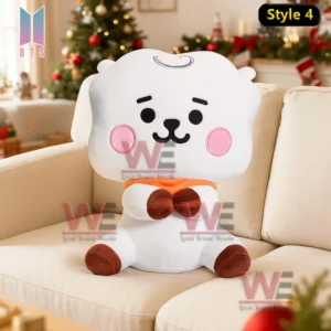 Round brown plush character sitting on a sofa with a decorated Christmas tree behind it!