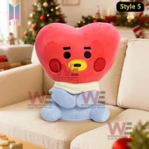 Pink rabbit like plush character sitting on a sofa with Christmas decorations in the background!