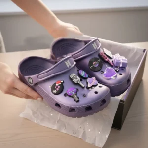 BTS Crocs Clogs with Charms 7 Hands holding purple Crocs with BTS charms above box!
