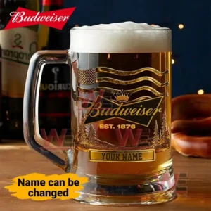 Glass Budweiser mug with gold logo design and customizable name plate displayed on a wooden table.