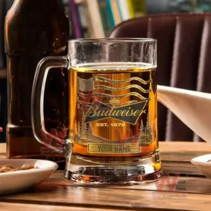 Budweiser Custom Beer Glasses 4 Budweiser engraved beer mug filled with beer placed among snacks and bottles on a wooden table.