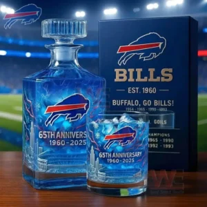 A blue anniversary bottle and glass set with team graphics displayed in front of a branded box with a stadium field and lights in the background!