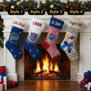 Four decorated stockings hang over a fireplace with wrapped gifts on the floor.