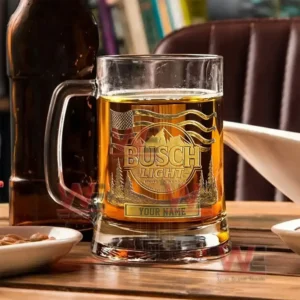 Alt text: Custom Busch Light beer mug with etched design, placed on a table with snacks and a beer bottle.