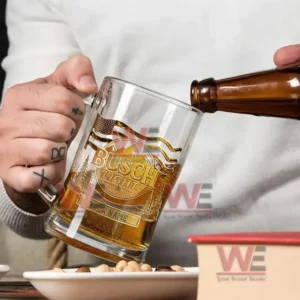 Alt text: Person pouring beer into a custom Busch Light beer mug with etched design and name engraving option.