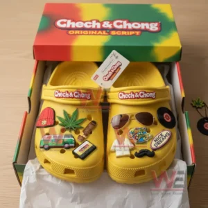 Yellow clogs with multiple themed charms displayed inside a vibrant product box.