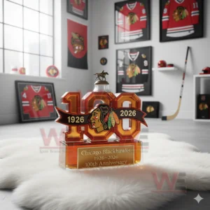 Chicago Blackhawks 1926-2026 100th Anniversary Whiskey Bottle 10 A number themed bottle celebrating the Blackhawks centennial set on a white rug with various team memorabilia!