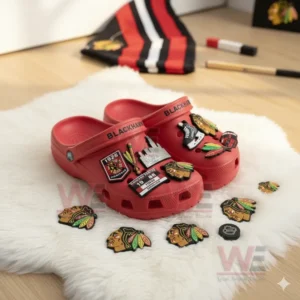 Chicago Blackhawks-themed Crocs with hockey and team charms on a soft background.